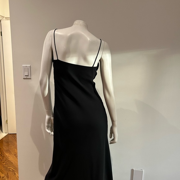 Long black dress with rosette trim across bust. - Picture 3 of 5